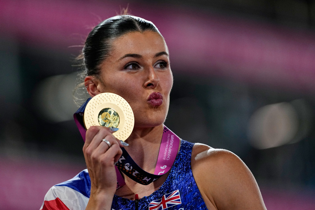 Britain's Amy Hunt celebrates after winning the gold medal in the women's 100 meters final at the European Athletics Championships in Birmingham, England, Monday, Aug. 10, 2026. (AP Photo/Petr David Josek)