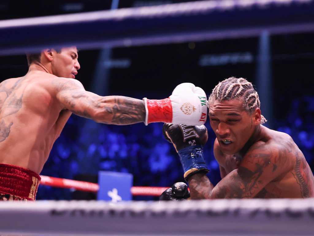 Ryan Garcia, left, punches Conor Benn in their welterweight championship fight Saturday, Sept. 12, 2026, in Las Vegas. (AP Photo/Ian Maule)