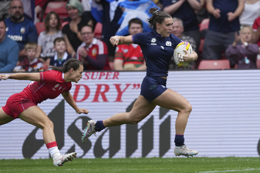 Scotland's Francesca McGhie runs on her way to score a try during the group B match at the 2025 Women's Rugby World Cup between Scotland and Wales in Manchester, England, Saturday, Aug. 23, 2025. (AP Photo/Dave Shopland)