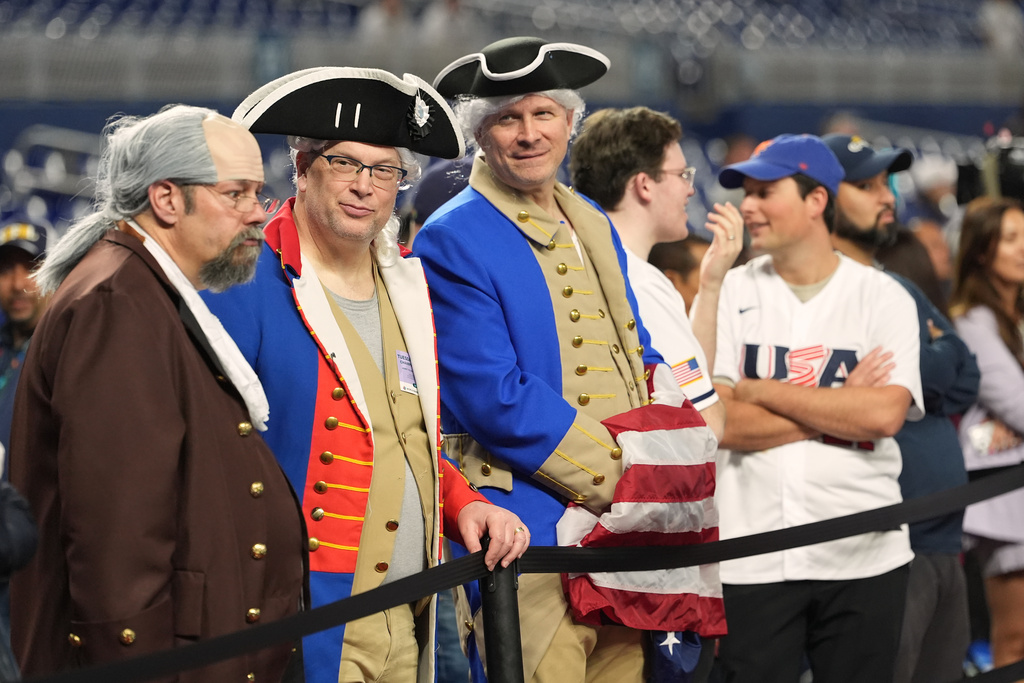 United States fans watch batting practice before the championship game of the World Baseball Classic against Venezuela, Tuesday, March 17, 2026, in Miami. (AP Photo/Lynne Sladky)