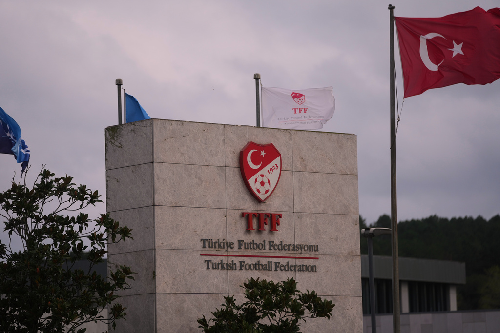 A Turkish flag waves at the Turkish Football Federation headquarters, in Istanbul, Turkey, Wednesday, Nov. 12, 2025. (AP Photo/Francisco Seco)