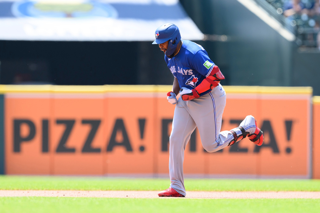 Toronto Blue Jays' Vladimir Guerrero Jr. celebrates as he runs the bases after hitting a solo home run against the Detroit Tigers in the first inning of a baseball game, Sunday, May 17, 2026, in Detroit. (AP Photo/Lon Horwedel)