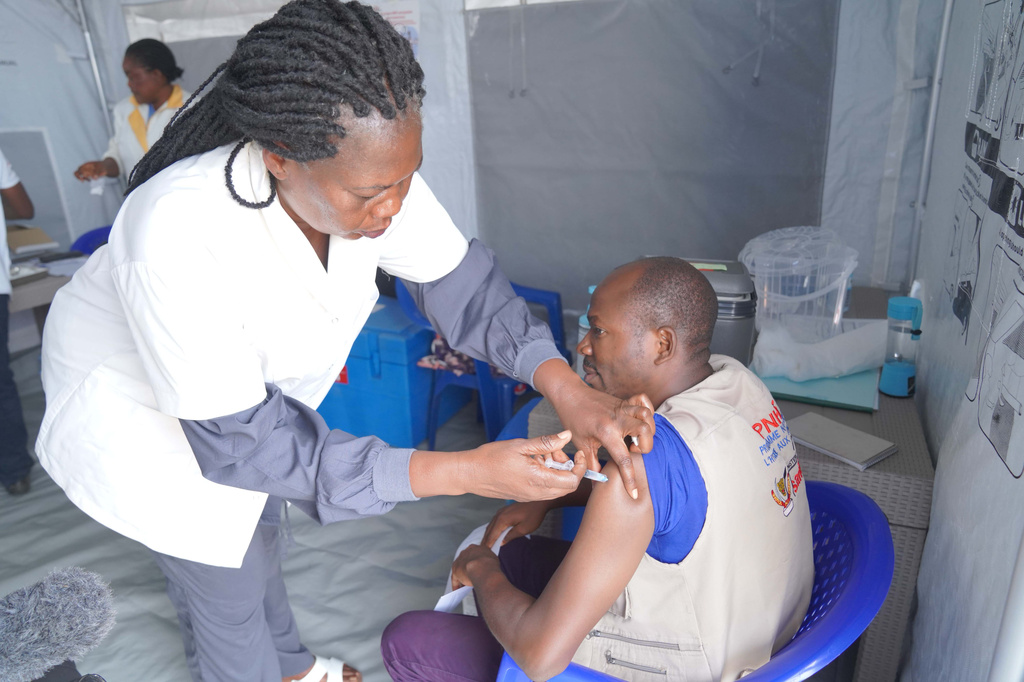A healthcare worker administers a dose of the Ervebo vaccine at an Ebola vaccination center in Bunia, Ituri province, Congo, Saturday, Sept. 19, 2026. (AP Photo/Dieudonne Dirole)