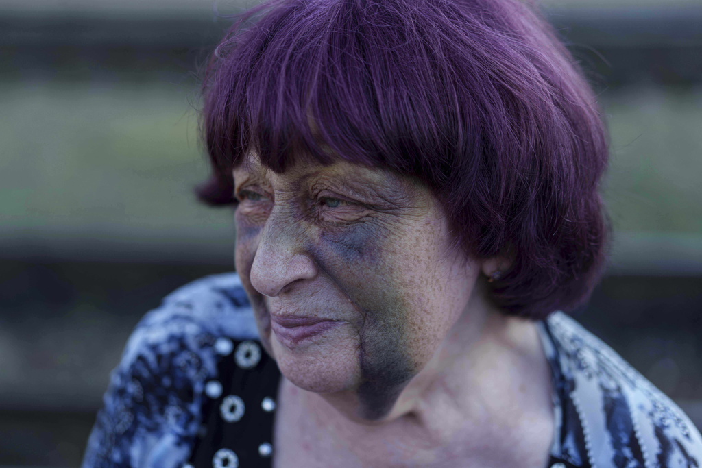 Tetiana Zaichikova, 69, stands on a platform of train station during evacuation in Lozova, Ukraine, Wednesday, Sept. 3, 2025. (AP Photo/Evgeniy Maloletka)
