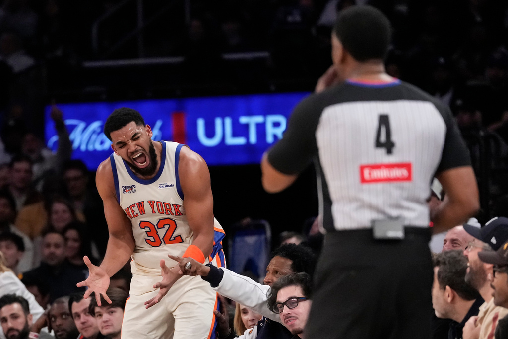 New York Knicks center Karl-Anthony Towns (32) reacts after giving a foul during the second half of an NBA basketball game, Saturday, Feb. 21, 2026, in New York. (AP Photo/Yuki Iwamura)
