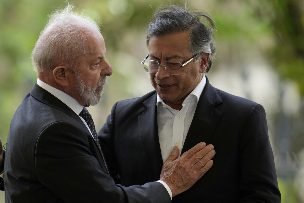 Brazil's President Luiz Inacio Lula da Silva pats Colombia's President Gustavo Petro during a meeting of leaders of the Amazon Cooperation Treaty Organization in Bogota, Colombia, Friday, Aug. 22, 2025. (AP Photo/Fernando Vergara)