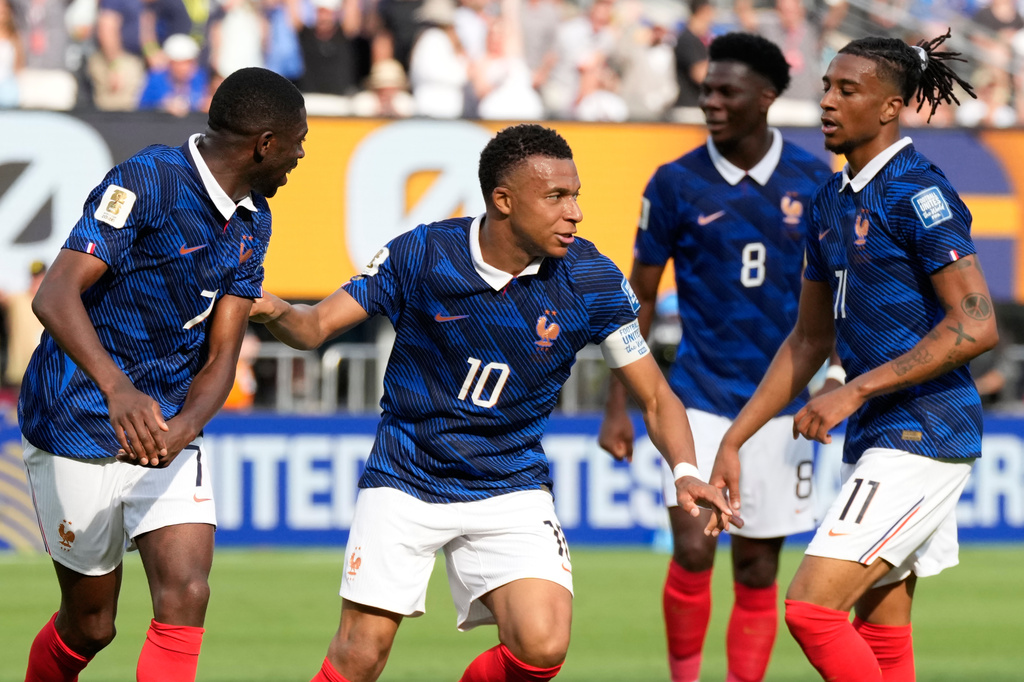 France's Kylian Mbappe, second right, celebrates with his teammates after scoring his side's opening goal during the World Cup round of 32 soccer match between France and Sweden in East Rutherford, N.J., near New York, Tuesday, June 30, 2026. (AP Photo/Seth Wenig)