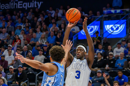 FILE - BYU forward AJ Dybantsa (3) shoots the ball over the defense of North Carolina guard Derek Dixon (3) during the first half of an NCAA college basketball exhibition game, Friday, Oct. 24, 2025, in Salt Lake City, Utah. (AP Photo/Tyler Tate, File) FILE - BYU forward AJ Dybantsa (3) shoots the ball over the defense of North Carolina guard Derek Dixon (3) during the first half of an NCAA college basketball exhibition game, Friday, Oct. 24, 2025, in Salt Lake City, Utah. (AP Photo/Tyler Tate, File)