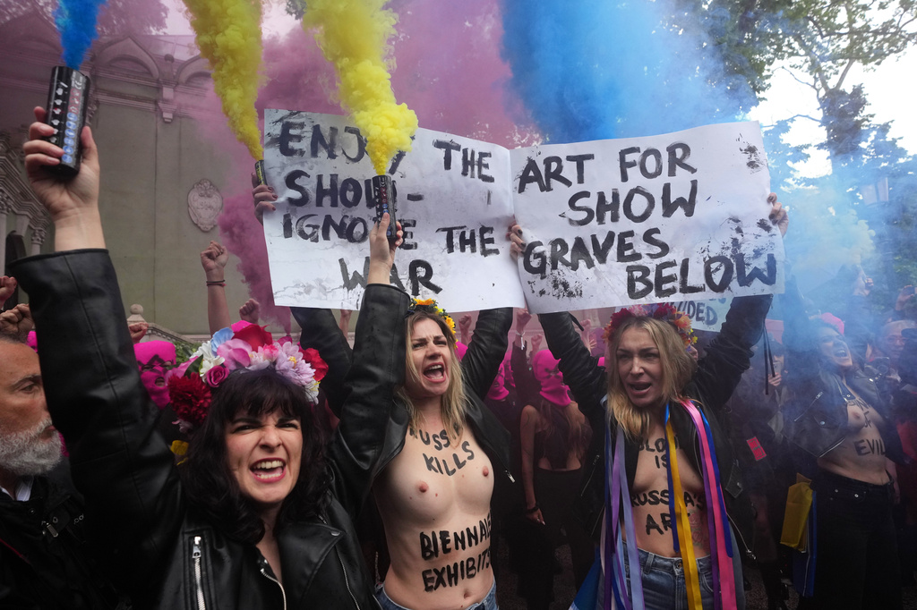 EDS NOTE: NUDITY - Pussy Riot and FEMEN activists stage a protest against Russia's presence after its absence following its 2022 invasion of Ukraine in front of the Russian pavilion, at the 2026 Art Venice Biennale, in Venice, Italy, Wednesday, May 6, 2026. (AP Photo/Luca Bruno)