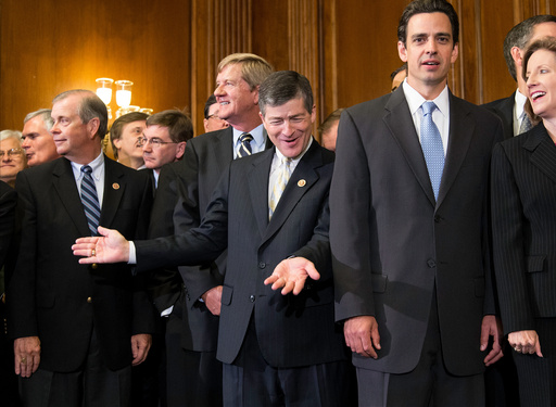 FILE - Rep. Jeb Hensarling, R-Texas, center, celebrates with fellow conservatives after Republicans passed a bill that would prevent a government shutdown while crippling the health care law that was the signature accomplishment of President Barack Obama's first term, Sept. 20, 2013, at the Capitol in Washington. (AP Photo/J. Scott Applewhite, File) FILE - Rep. Jeb Hensarling, R-Texas, center, celebrates with fellow conservatives after Republicans passed a bill that would prevent a government shutdown while crippling the health care law that was the signature accomplishment of President Barack Obama's first term, Sept. 20, 2013, at the Capitol in Washington. (AP Photo/J. Scott Applewhite, File)