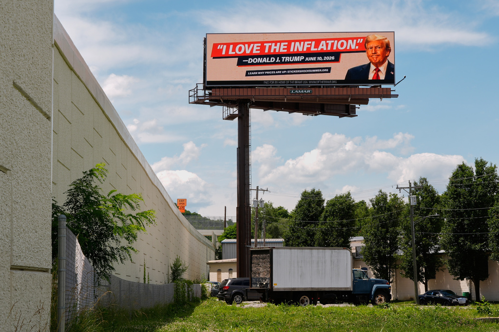 An electronic billboard that reads "I love the inflation." - Donald J. Trump June 10, 2026," is seen near I-74 in Cincinnati, Tuesday, June 16, 2026. (AP Photo/Carolyn Kaster)