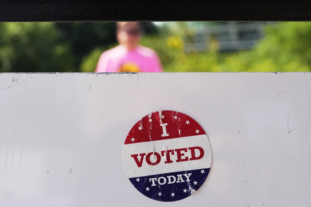 An " I Voted Today" sticker on an information sign at Olbrich Gardens Tuesday, Aug. 11, 2026, in Madison, Wis. (AP Photo/Nam Y. Huh)