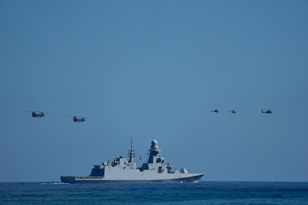 Military helicopters fly over the Italian Navy frigate Luigi Rizzo during Medusa 15, a multinational military exercise led by Greece and Egypt, at Maleme on the Greek island of Crete, Friday, Sept. 18, 2026. (AP Photo/Thanassis Stavrakis)