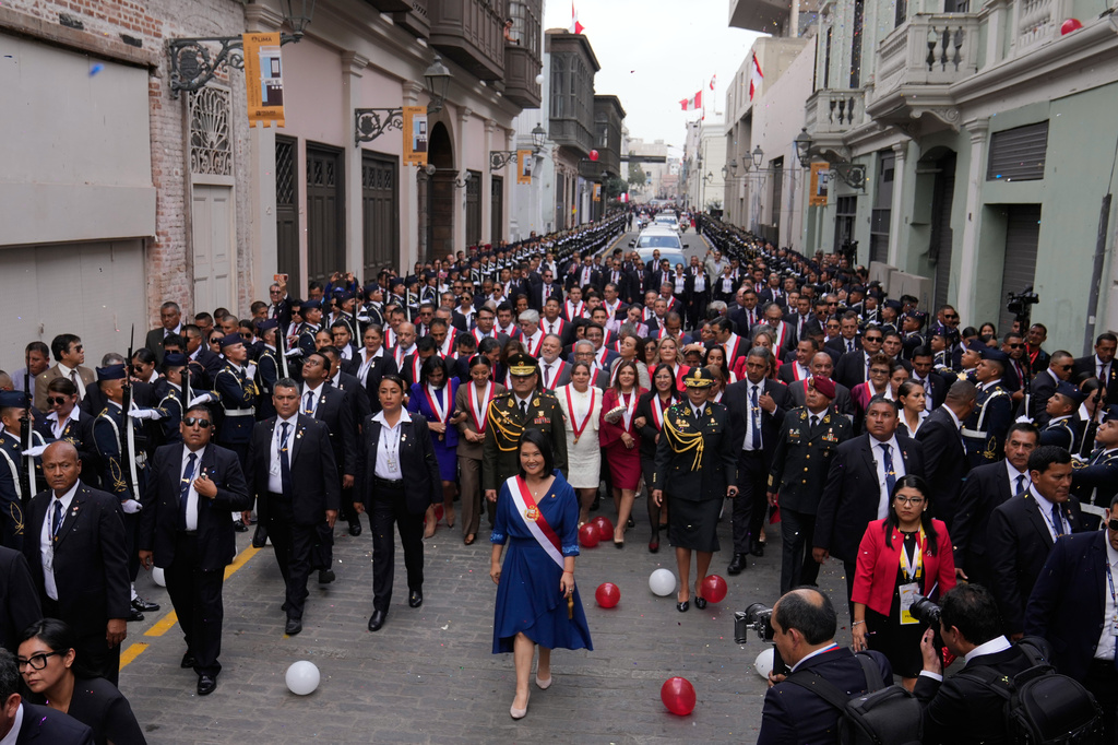 Peru's President Keiko Fujimori walks to the presidential palace after her inauguration in Lima, Peru, Tuesday, July 28, 2026. (AP Photo/Martin Mejia)