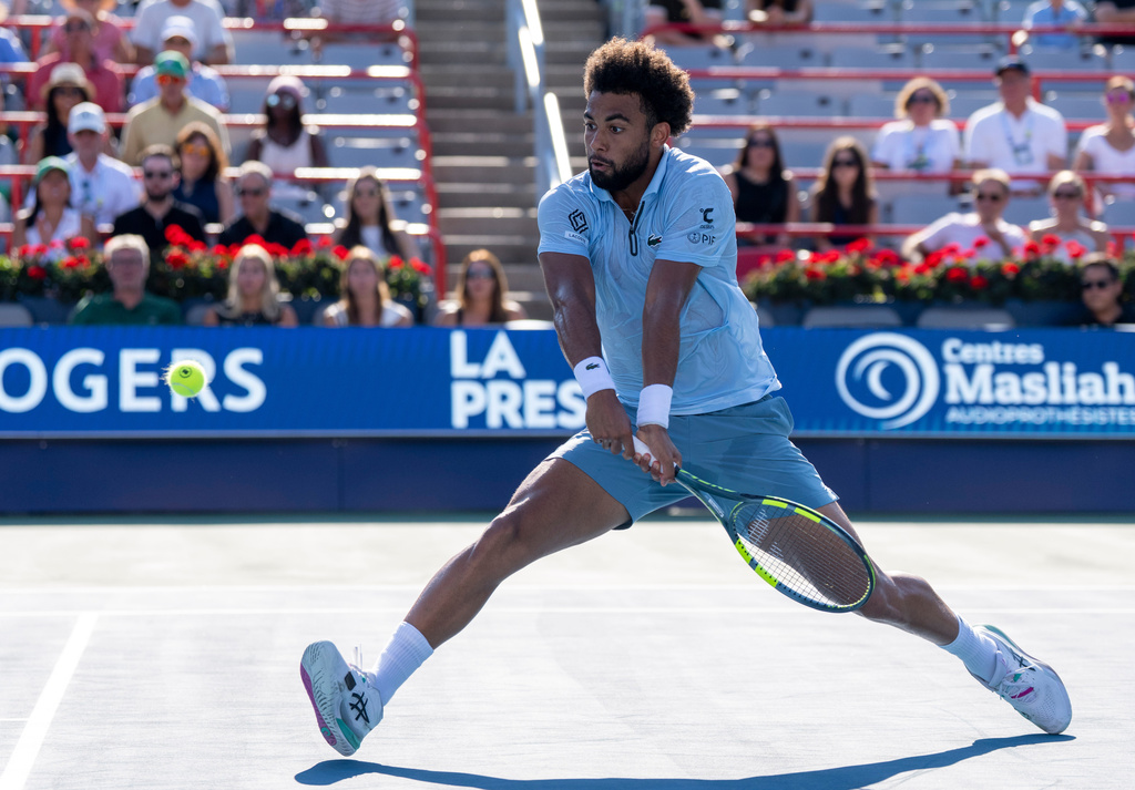 Arthur Fils of France hits a return to Rafael Jodar of Spain during his quarter final tennis match at the National Bank Open in Montreal on Tuesday, Aug. 11, 2026. (Christinne Muschi/The Canadian Press via AP)