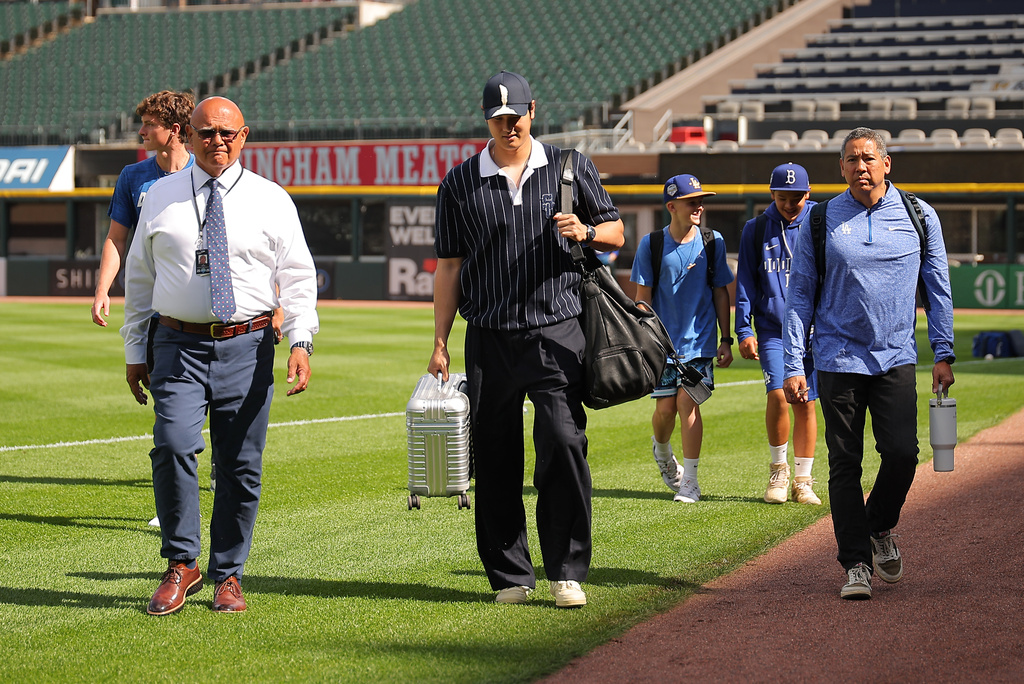 Los Angeles Dodgers' Shohei Ohtani enters the field prior to a baseball game against the Chicago White Sox, Friday, June 12, 2026, in Chicago. (AP Photo/Melissa Tamez)