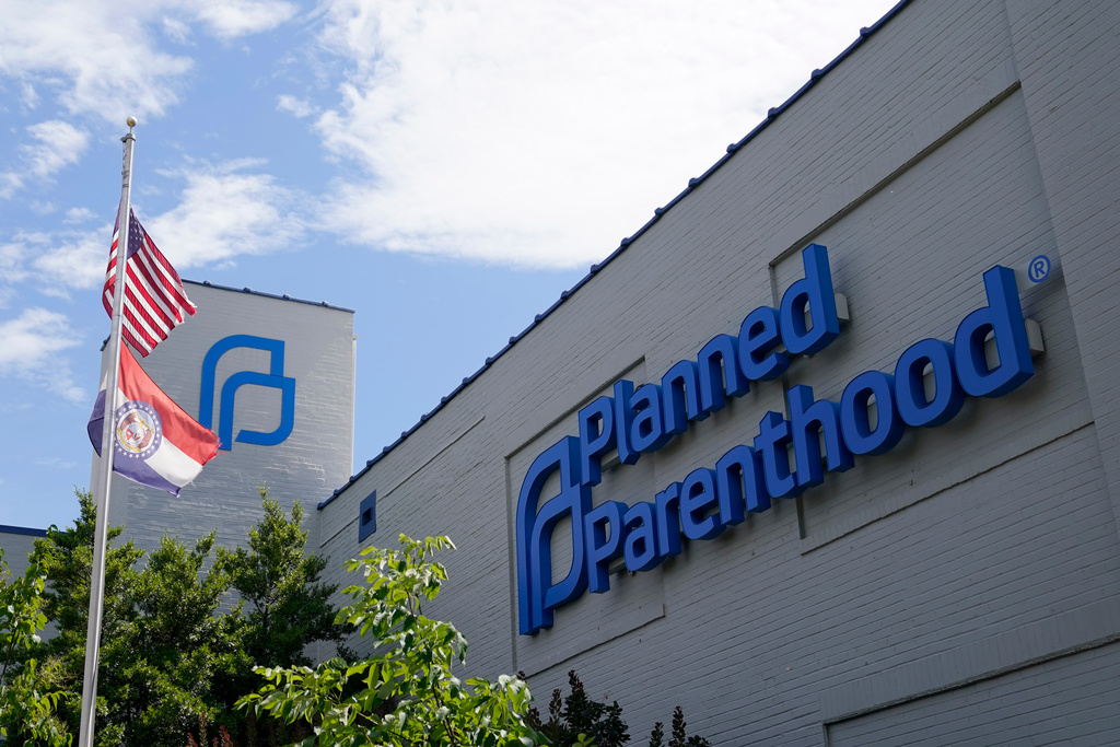 FILE - A Missouri and an American flag fly outside the Planned Parenthood in St. Louis on June 24, 2022. (AP Photo/Jeff Roberson, File)
