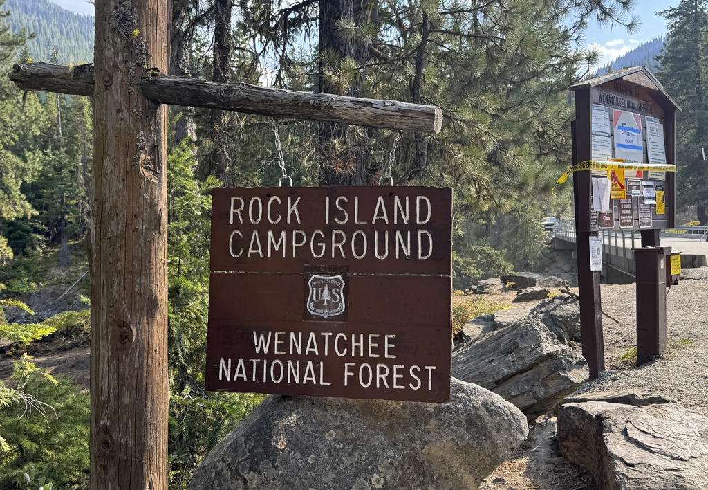 This photo provided by FBI Seattle shows the entrance to Rock Island Campground where multiple law enforcement agencies are participating in the search for Travis Decker, who was charged with murder and kidnapping, near Leavenworth, Wa. on Monday, August. 25, 2025. (FBI via AP)