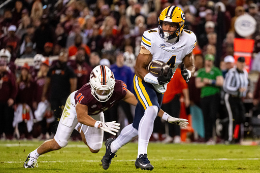 California wide receiver Jordan King (4) gets by Virginia Tech safety Tyson Flowers (11) during the first half of an NCAA college football Friday Oct. 24, 2025, in Blacksburg, Va. (AP Photo/Robert Simmons) California wide receiver Jordan King (4) gets by Virginia Tech safety Tyson Flowers (11) during the first half of an NCAA college football Friday Oct. 24, 2025, in Blacksburg, Va. (AP Photo/Robert Simmons)