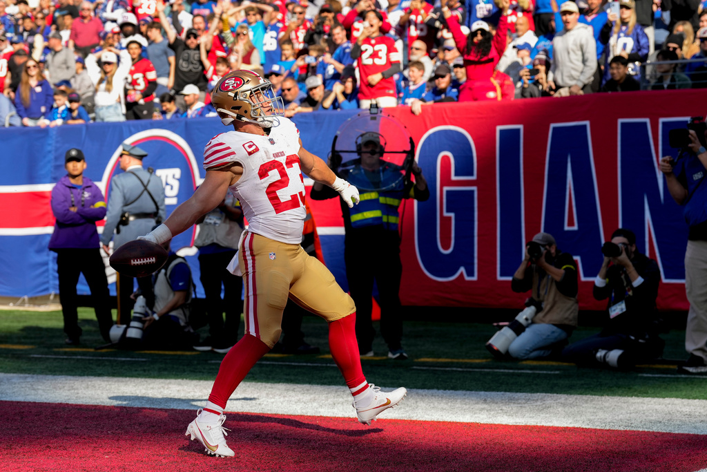 San Francisco 49ers running back Christian McCaffrey (23) reacts after scoring a touchdown against the New York Giants during the first quarter of an NFL football game, Sunday, Nov. 2, 2025, in East Rutherford, N.J. (AP Photo/Seth Wenig)