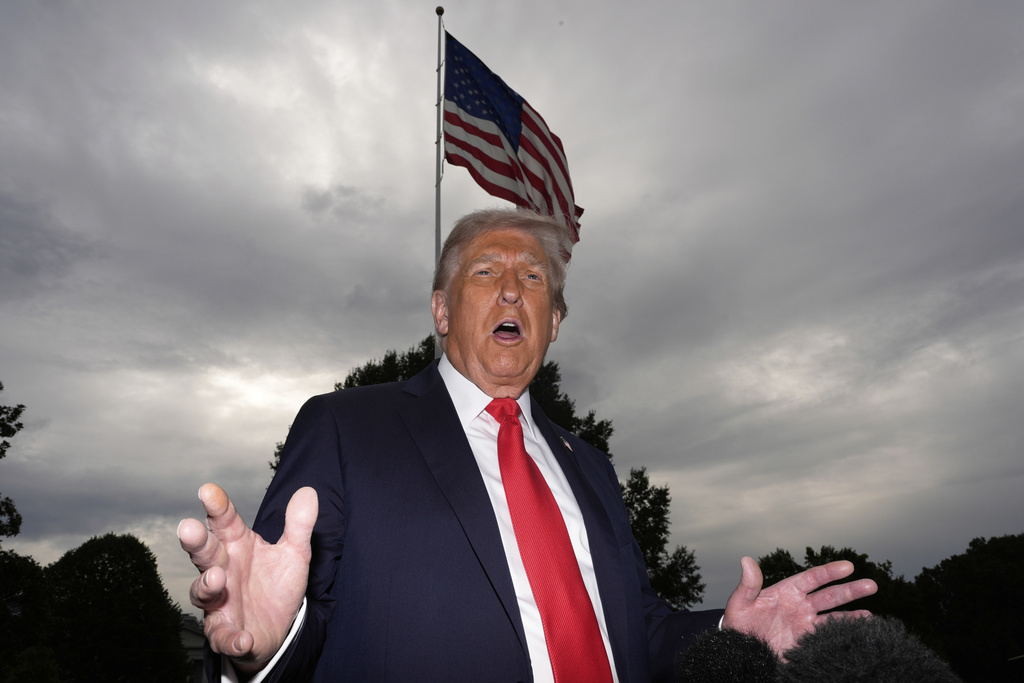 President Donald Trump speaks with reporters before departing on Marine One from the South Lawn of the White House, Tuesday, Sept. 16, 2025, in Washington. (AP Photo/Alex Brandon)