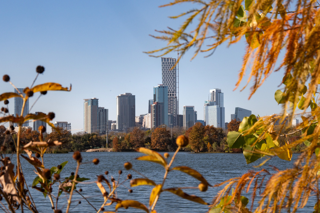 FILE - Foliage frames the skyline of downtown Austin, Texas, Dec. 10, 2025. (Mikala Compton/Austin American-Statesman via AP, File)