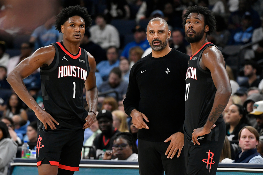 Houston Rockets head coach Ime Udoka talks with guard Amen Thompson (1) and forward Tari Eason (17) in the second half of an NBA basketball game against the Memphis Grizzlies Wednesday, Nov. 5, 2025, in Memphis, Tenn. (AP Photo/Brandon Dill)