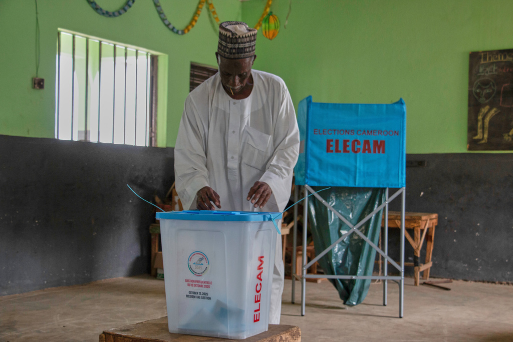 A man casts his ballot at a polling station during the presidential election in Garoua, Cameroon, Sunday, Oct. 12, 2025.(AP Photo/Welba Yamo Pascal)