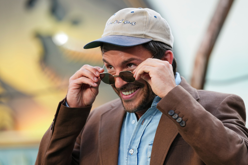 FILE - Jonathan Bailey poses for photographers upon arrival at the premiere of the film 'Jurassic World Rebirth' June 17, 2025, in London. (Photo by Scott A Garfitt/Invision/AP, File)