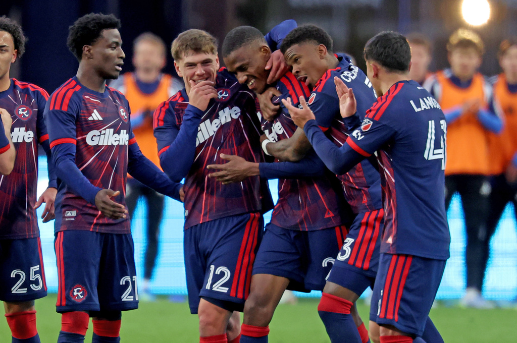 New England Revolution defender Mamadou Fofana, center, is surrounded by teammates after he scored a goal in the second half of an MLS soccer match against CF Montreal, Saturday, April 4, 2026, in Foxborough, Mass. (AP Photo/Mark Stockwell)