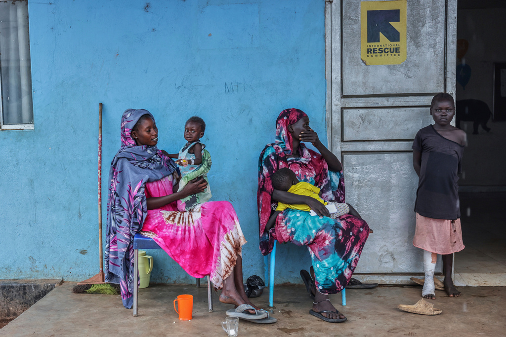 Patients sit outside the malnutrition ward of Bunj Hospital in Maban, South Sudan, Aug. 19, 2025. (AP Photo/Caitlin Kelly, File)