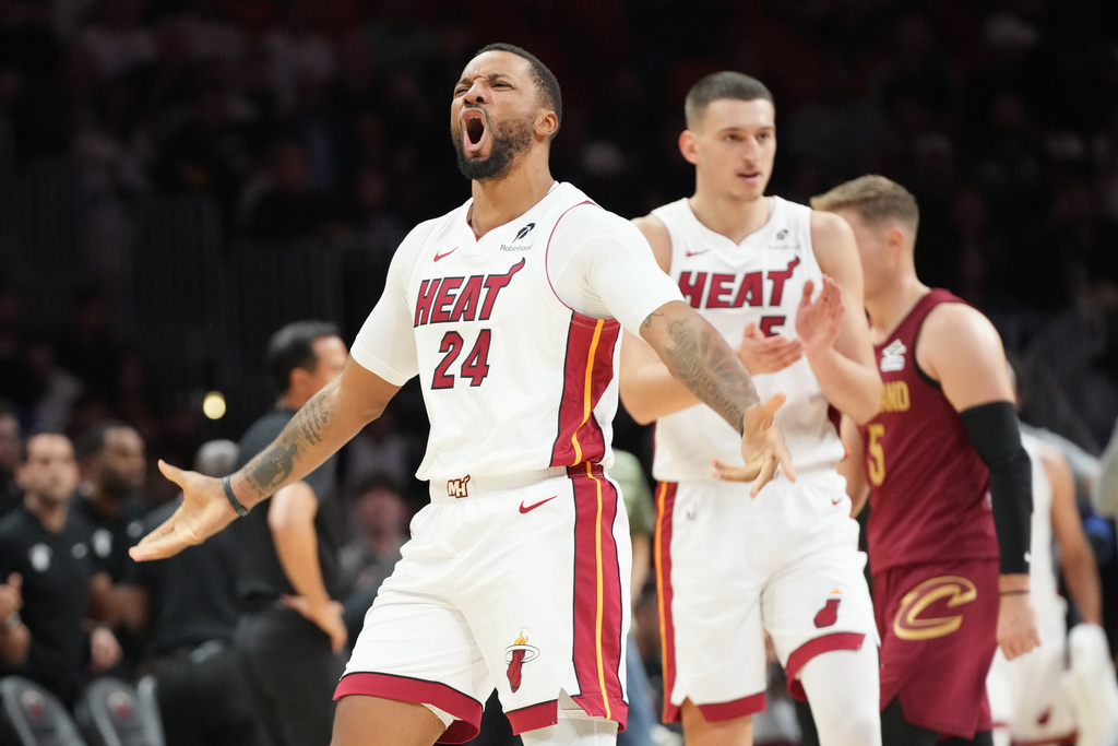 Miami Heat guard Norman Powell (24) reacts after scoring during the second half of an NBA basketball game against the Cleveland Cavaliers Monday, Nov. 10, 2025, in Miami. (AP Photo/Marta Lavandier)