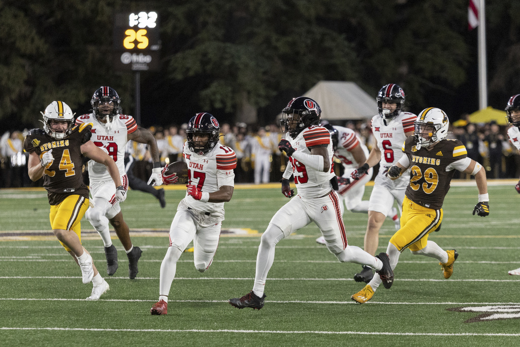 Utah wide receiver Rayshawn Glover runs the ball during the first half of an NCAA college football game, Saturday, Sept. 13, 2025, in Laramie, Wyo. (AP Photo/Matthew Idler)