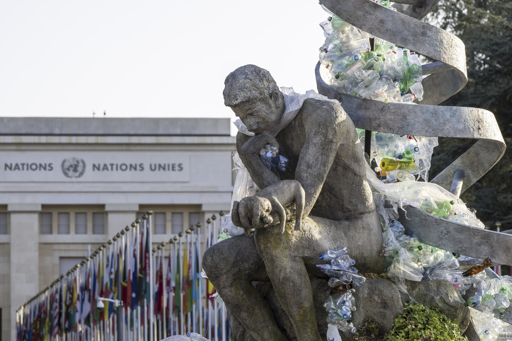 Plastic items are displayed at an artwork by Canadian artist and activist Benjamin Von Wong, titled "The Thinker's Burden", during the fifth session of the Intergovernmental Negotiating Committee on Plastic Pollution, at the European headquarters of the United Nations in Geneva, Switzerland, Friday, Aug. 15, 2025. (Martial Trezzini/Keystone via AP)