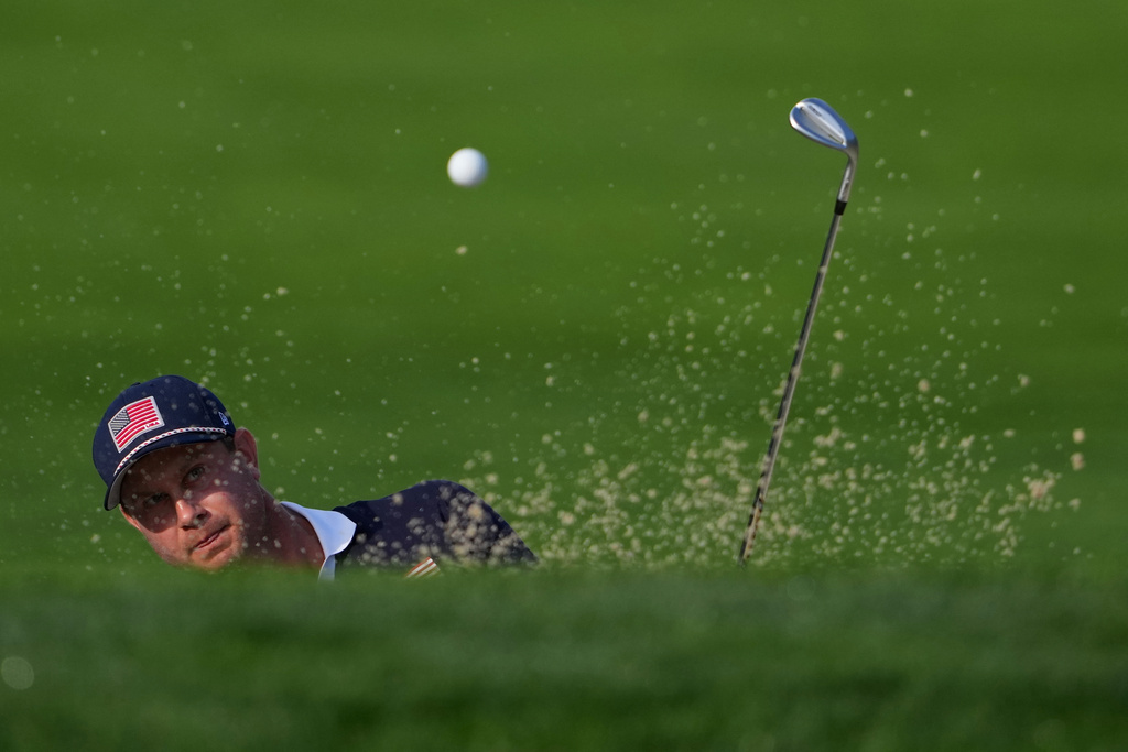 United States' Harris English hits from the bunker on the seventh hole at Bethpage Black golf course during the Ryder Cup golf tournament, Saturday, Sept. 27, 2025, in Farmingdale, N.Y. (AP Photo/Lindsey Wasson)