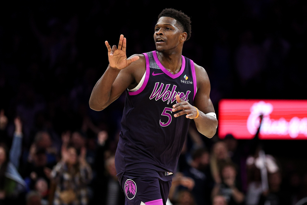 Minnesota Timberwolves guard Anthony Edwards celebrates his three-point basket against the Oklahoma City Thunder during the second half of an NBA basketball game Friday, Dec. 19, 2025, in Minneapolis. (AP Photo/Matt Krohn)