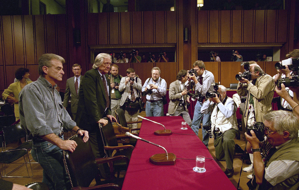 FILE - Photographers capture the arrival of Randy Weaver, left, and his attorney Gerry Spence for a hearing of a Senate Judiciary subcommittee on Capitol Hill in Washington, Sept. 6, 1995. (AP Photo/Dennis Cook, File)
