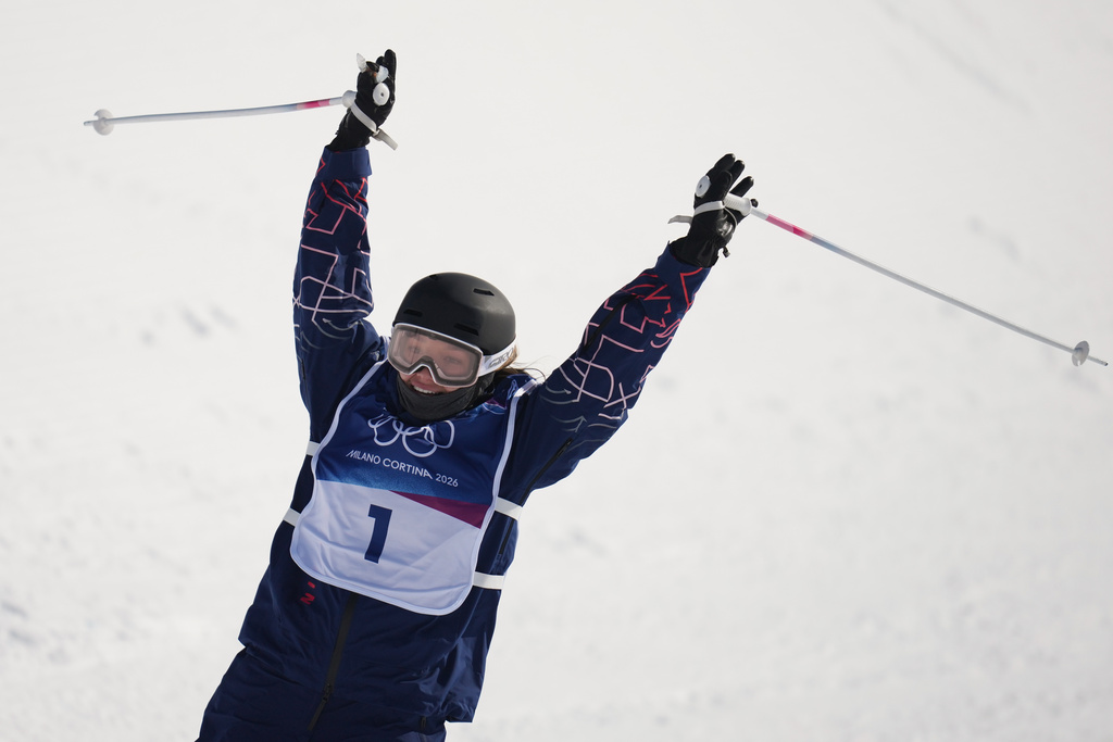 Britain's Zoe Atkin celebrates during the women's freestyle skiing halfpipe final at the 2026 Winter Olympics, in Livigno, Italy, Sunday, Feb. 22, 2026. (AP Photo/Abbie Parr)