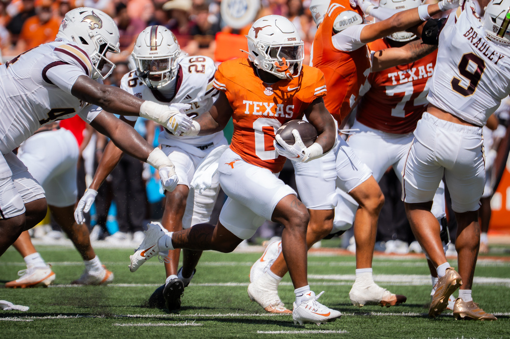 Texas' running back Raleek Brown (0) runs the ball in to score in the second quarter of an NCAA college football game against the Texas State in Austin, Sept. 5, 2026. (Sara Diggins/The San Antonio Express-News via AP)