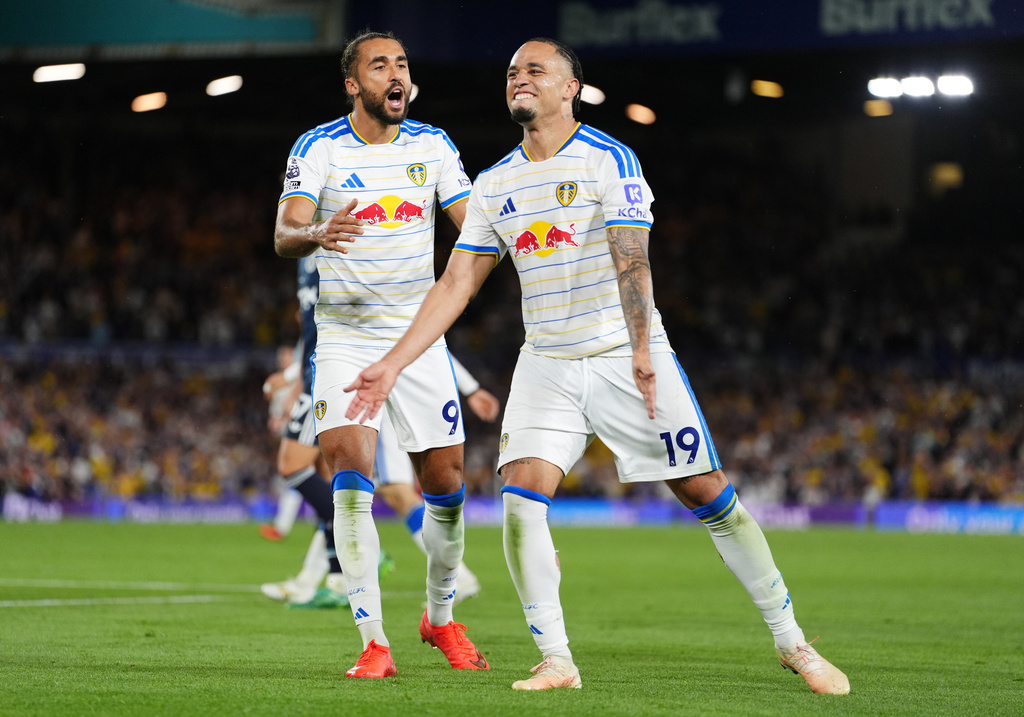 Leeds United's Noah Okafor, right, celebrates scoring their side's fourth goal with Dominic Calvert-Lewin during the English Premier League soccer match between Leeds United and Newcastle United in Leeds, England, Monday, Sept. 14, 2026. (Annabel Lee-Ellis/PA via AP)