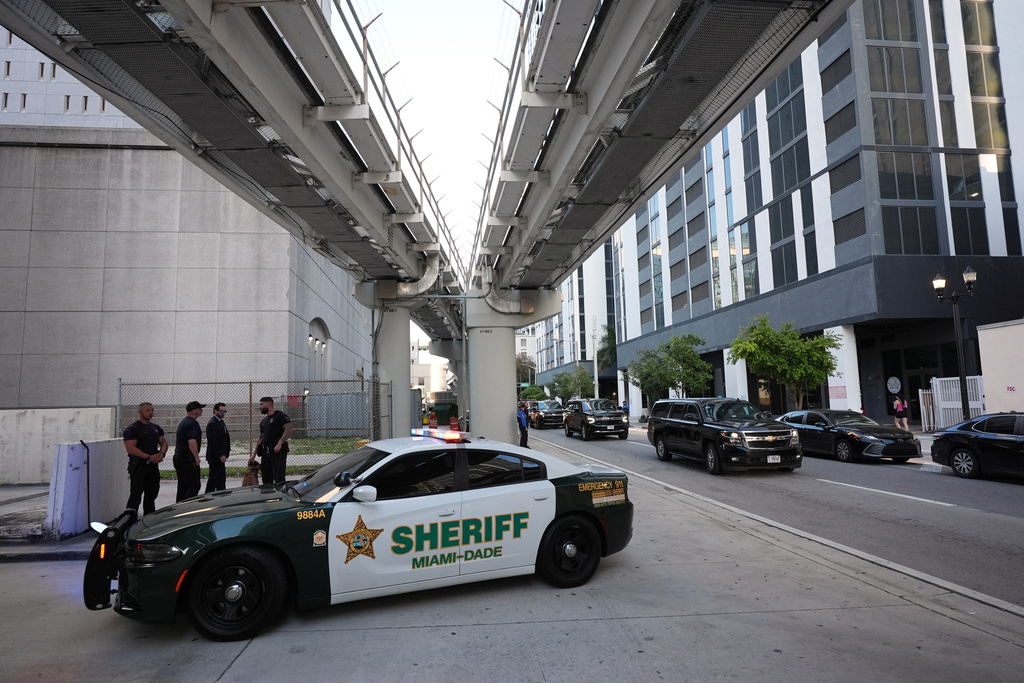 A convoy carrying Secretary of State Marco Rubio arrives at the James Lawrence King Federal Building where Rubio was set to testify in the trial of his former roommate David Rivera, Tuesday, March 24, 2026, in Miami. (AP Photo/Rebecca Blackwell)