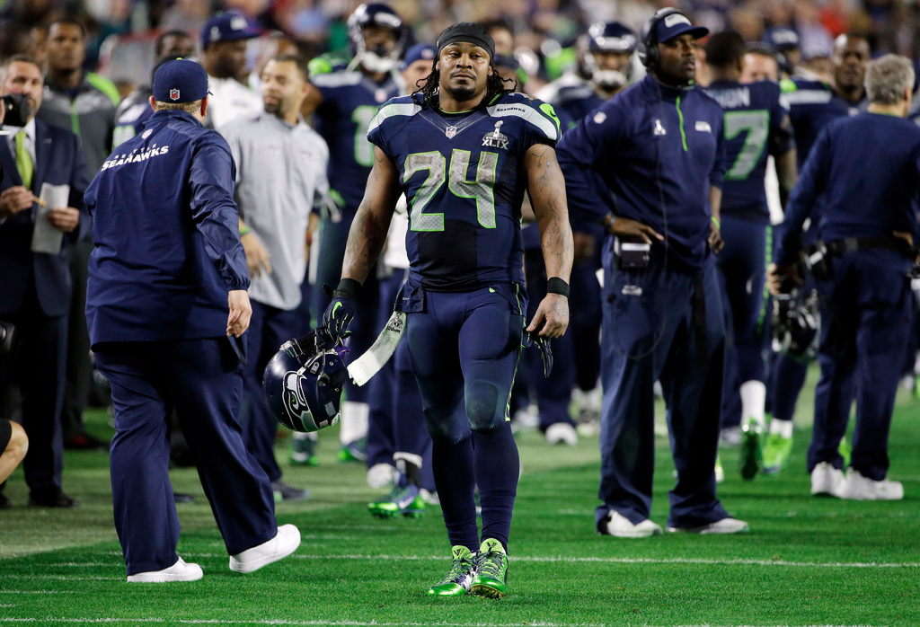 FILE - Seattle Seahawks running back Marshawn Lynch (24) walks off the field after the Seahawks lost to the New England Patriots during the NFL Super Bowl XLIX football game, Feb. 1, 2015, in Glendale, Ariz. (AP Photo/Matt Rourke, File)