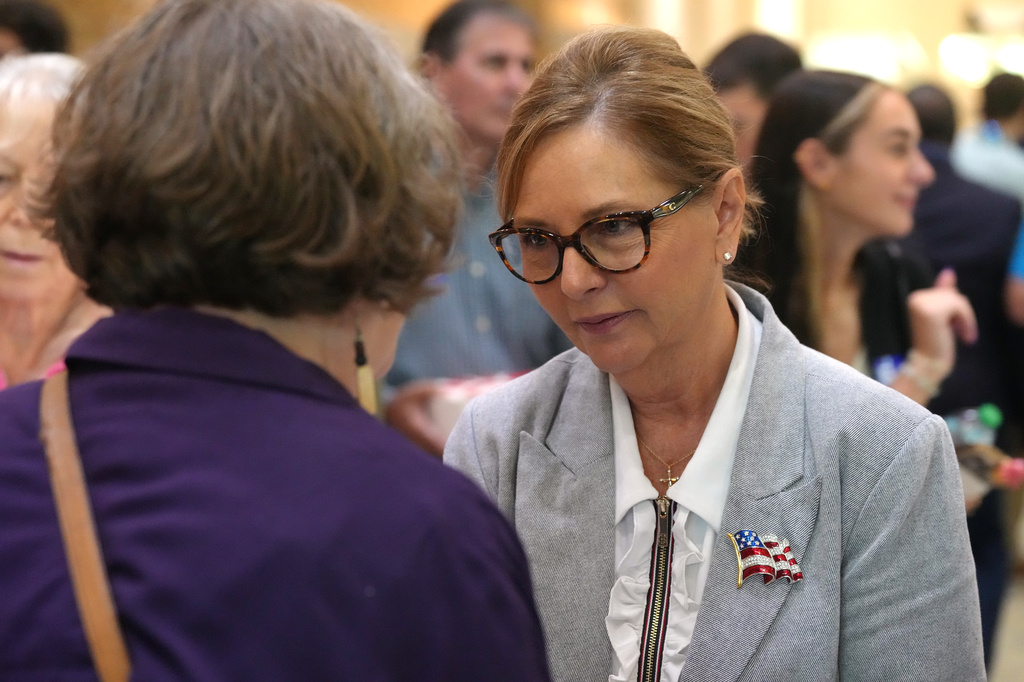 Sen. Darline Graham, R-S.C., speaks with voters following a Senate candidate stump event ahead of a special GOP primary to select a replacement for her late brother, Sen. Lindsey Graham, Saturday, Aug. 1, 2026, in Lexington, S.C. (AP Photo/Meg Kinnard)