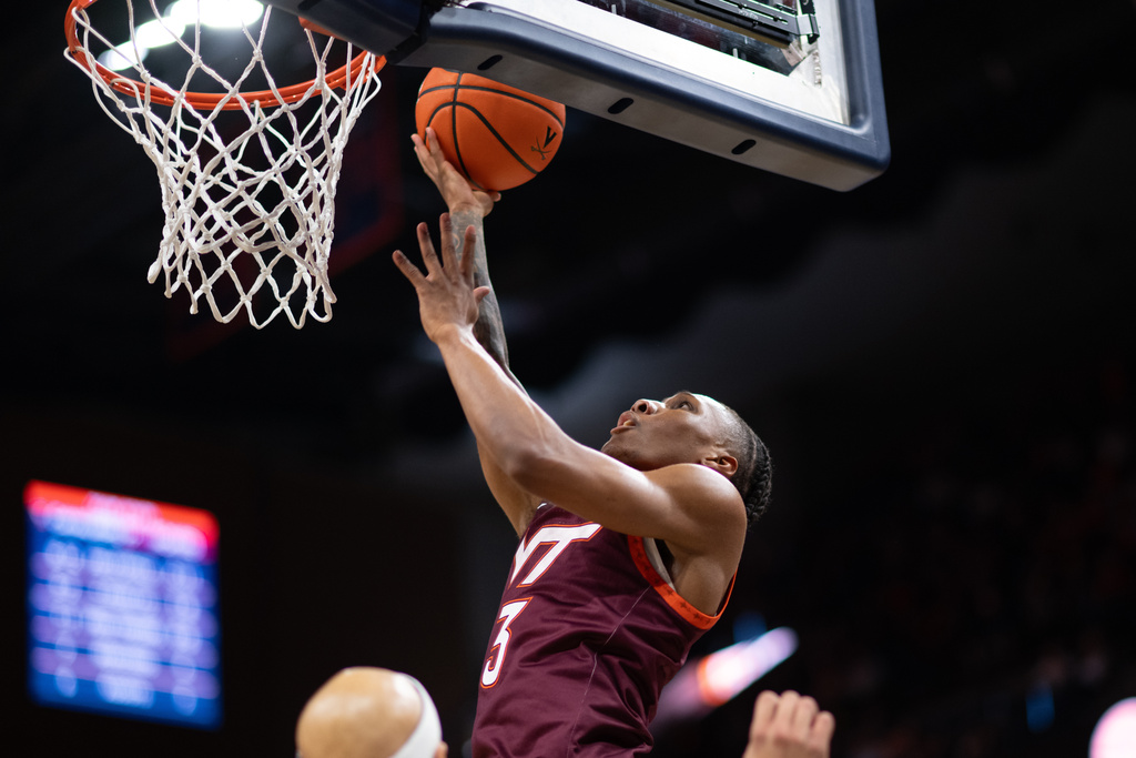 Virginia Tech guard Ben Hammond (3) gets to the rim against Virginia during the first half of an NCAA college basketball game, Saturday, March 7, 2026, in Charlottesville, Va. (AP Photo/Robert Simmons)