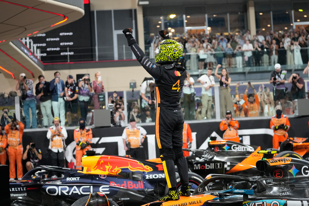McLaren driver Lando Norris of Britain reacts after becoming a world champion after the Abu Dhabi Formula One Grand Prix in Abu Dhabi, United Arab Emirates, Sunday, Dec. 7, 2025. (AP Photo/Darko Bandic)