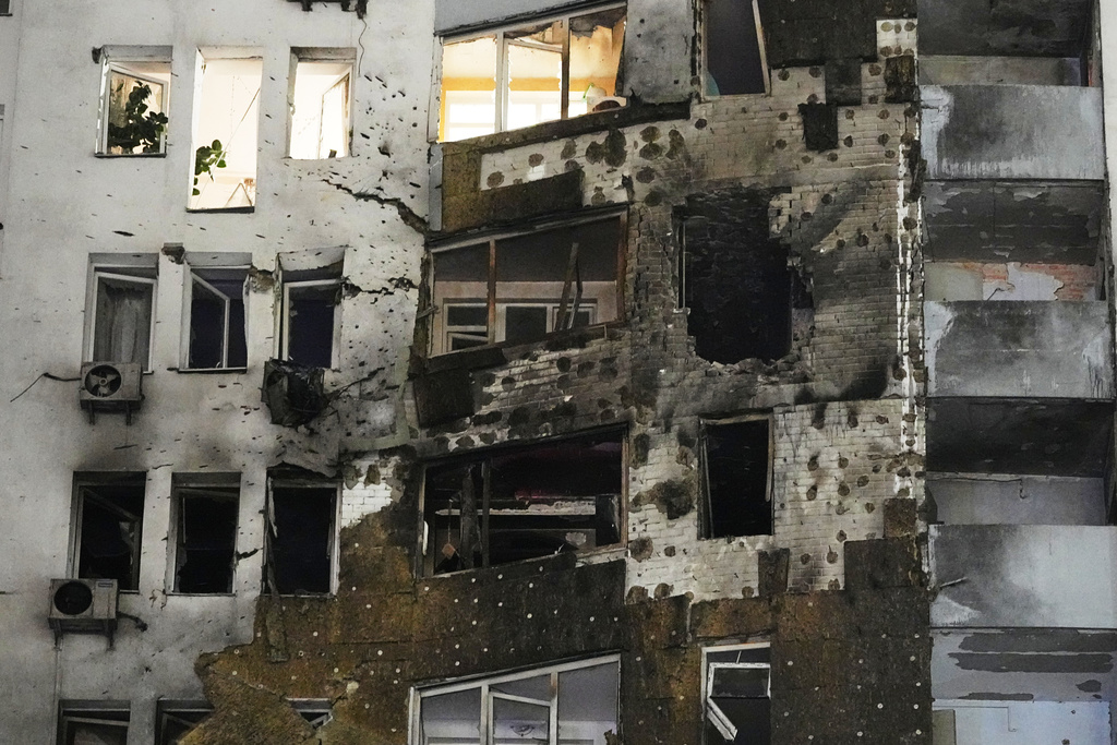 A residential building is seen damaged after a Russian strike in Kyiv, Ukraine, Friday, Jan. 9, 2026. (AP Photo/Efrem Lukatsky)