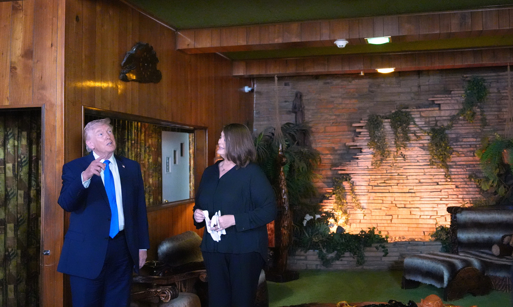 President Donald Trump tours the Jungle Room at Graceland, Elvis Presley's historic estate, Monday, March 23, 2026, in Memphis, Tenn. (AP Photo/Mark Schiefelbein)