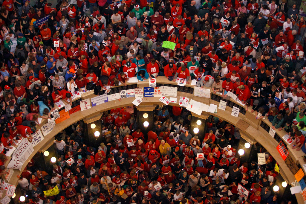 FILE - Protestors of Wisconsin Gov. Scott Walker's bill to eliminate collective bargaining rights for many state workers pack the rotunda at the State Capitol Feb. 17, 2011, in Madison, Wis. (AP Photo/Andy Manis, File)