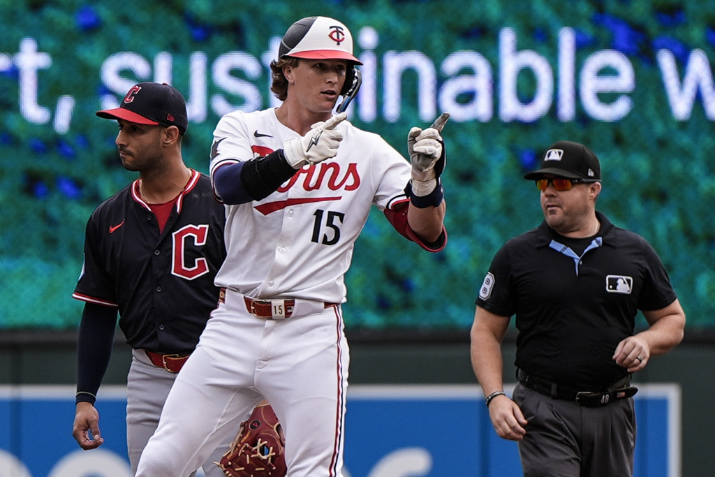 Minnesota Twins' Luke Keaschall (15) celebrates his double against the Cleveland Guardians in the second inning of a baseball game, Saturday, Sept. 20, 2025, in Minneapolis. (AP Photo/Mike Stewart)
