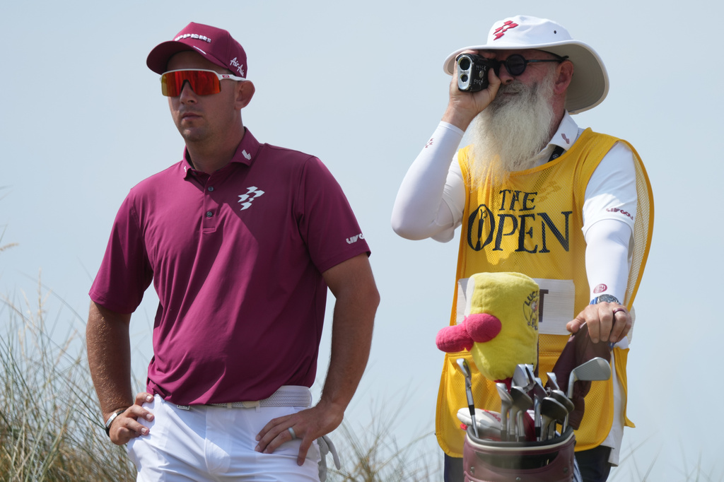 Lucas Herbert of Australia with his caddie Nick Pugh, look at the 13th hole from the tee during the second day of the British Open Golf championships at Royal Birkdale golf club, in Southport, England, Friday, July 17, 2026. (AP Photo/Jon Super)